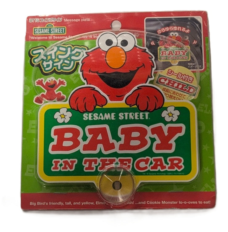 Sesame Street Elmo Baby in the Car suction cup sign with bold red and green design