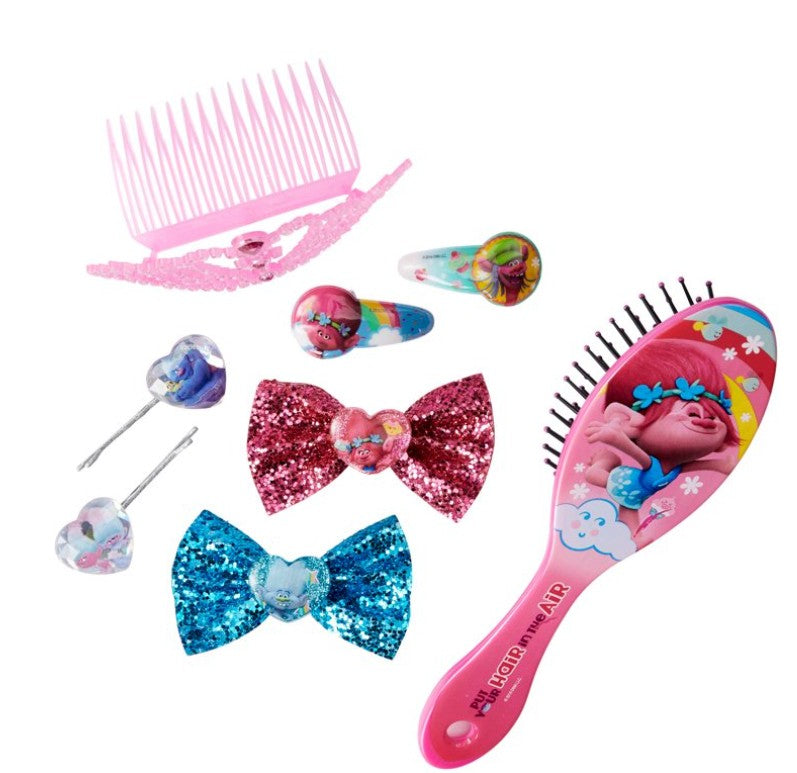 Close-up of brush, tiara, and glitter bows from Trolls hair set

